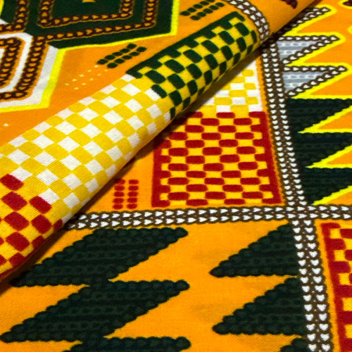 Close-up of colorful fabric with geometric patterns in yellow, red, black, and white.