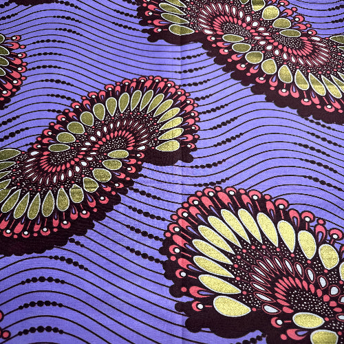 Decorative fabric with circular patterns on a purple background