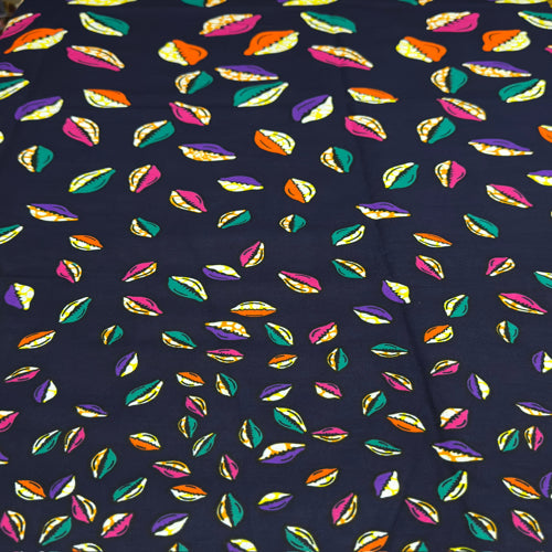 Colorful leaf pattern on a dark blue fabric background