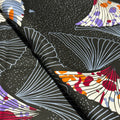 Close-up of fabric with abstract patterns on a black background