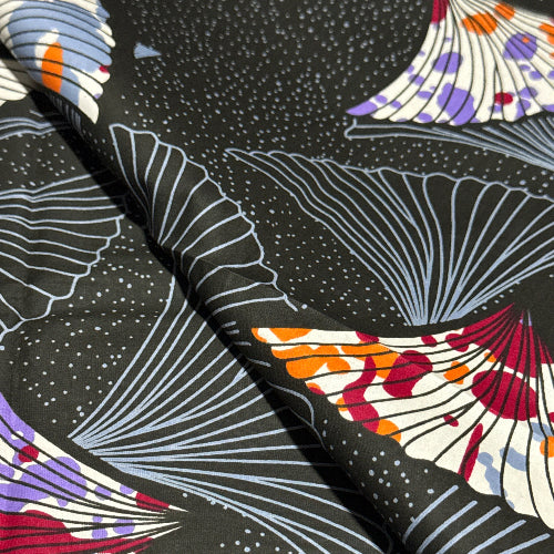 Close-up of fabric with abstract patterns on a black background