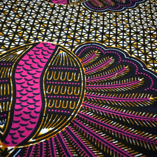 Close-up of a vibrant fabric pattern with pink, purple, and gold colors.