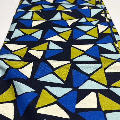 Geometric triangle pattern fabric with blue, yellow, and white colors.