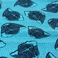 Pattern of blue leaf shapes on a blue background