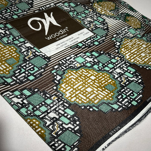 Close-up of a printed circuit board with Uoboom branding
