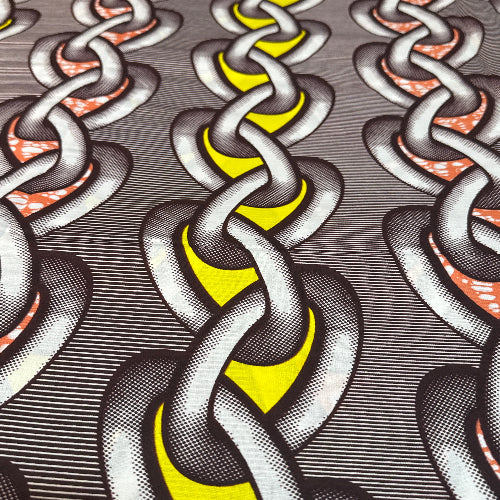 Close-up of interlocking chains with a geometric pattern