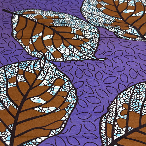 Patterned fabric with brown leaves on a purple background