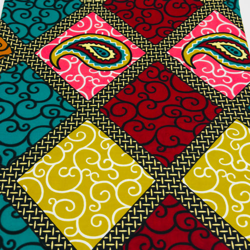 Colorful fabric with geometric patterns and a gold border