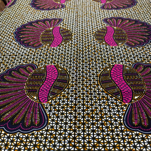Close-up of decorative fabric with purple and gold patterns