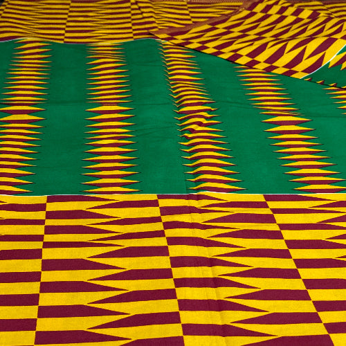 Kente fabric with green, yellow, and red patterns