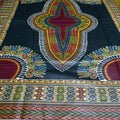 Colorful traditional fabric with intricate patterns on a dark blue background