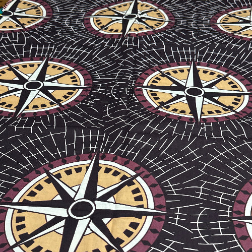 Pattern of compasses on a black background