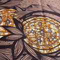 Decorative pattern with circular design, stars, and leaves on a textured background