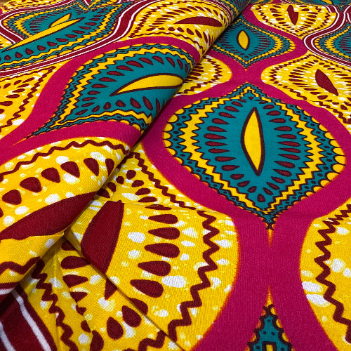 Close-up of colorful African fabric with intricate patterns.