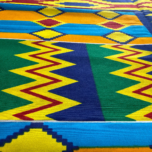 Colorful fabric with geometric patterns in yellow, green, red, and blue.