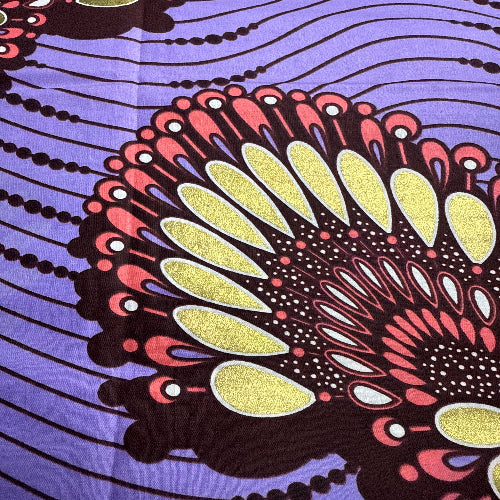 Close-up of a colorful abstract pattern with purple background