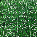 Patterned fabric with green and black design