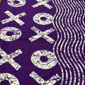 Purple fabric with white 'XOXO' pattern