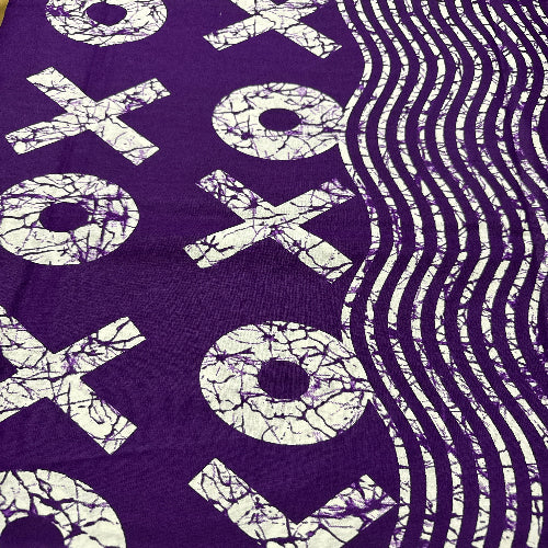 Purple fabric with white 'XOXO' pattern