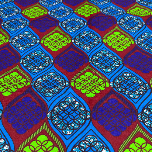 Colorful geometric patterned fabric with blue, green, and red colors.