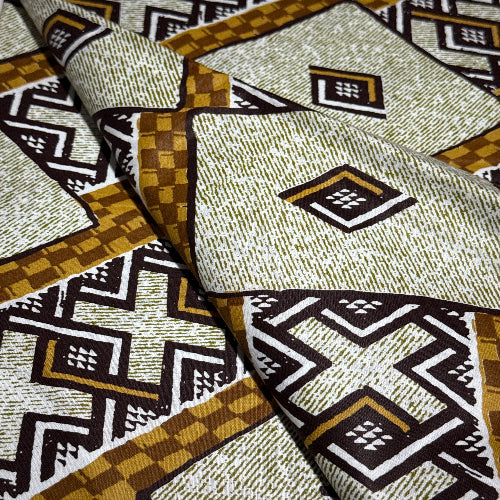 Patterned fabric with geometric design in brown, black, and beige.