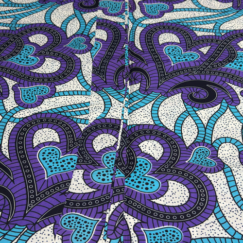 Patterned fabric with blue and purple design on a white background