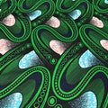 Close-up of a green and black abstract pattern with white and blue accents