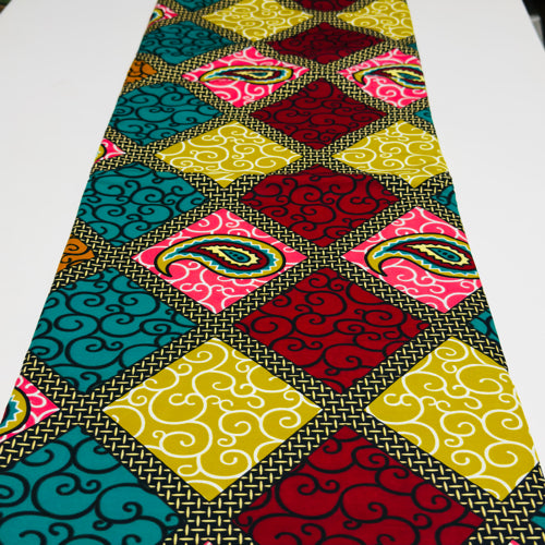 Colorful patterned fabric with geometric designs on a white background
