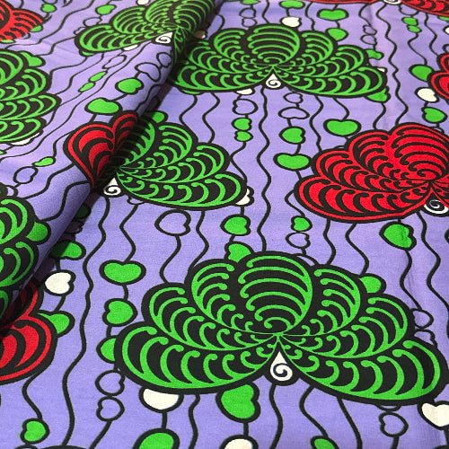 Colorful pattern with green and red shapes on a purple background