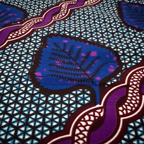 Close-up of a fabric with purple and blue patterns on a geometric background