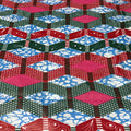 Colorful geometric patterned fabric with red, blue, green, and pink colors.