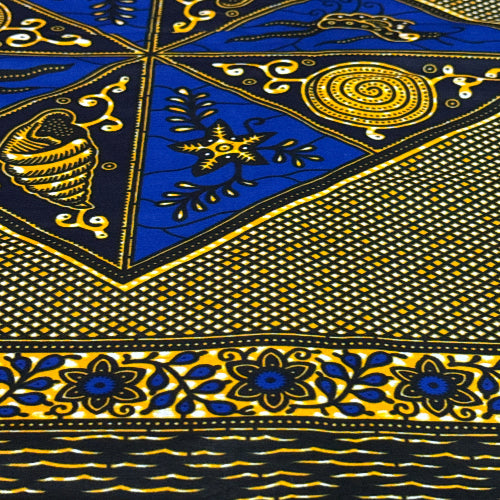 Close-up of a patterned fabric with blue and gold designs.