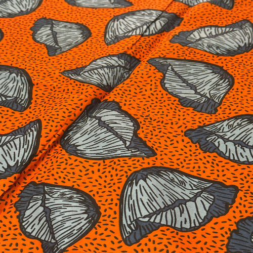 Pattern of black leaves on an orange background