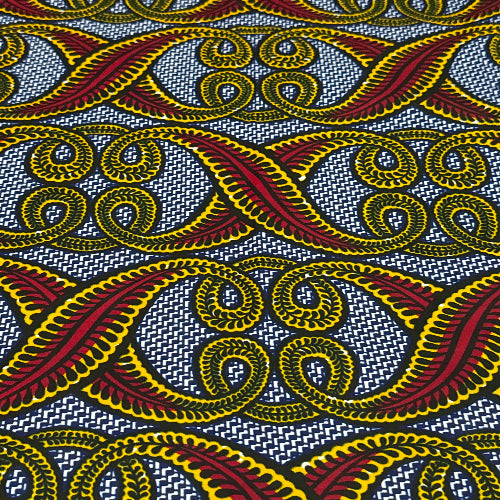 Close-up of fabric with red, yellow, and black pattern