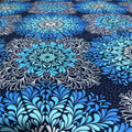 Blue and black floral pattern on a dark blue background