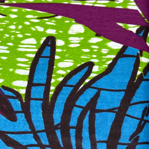 Close-up of colorful abstract pattern with purple, green, blue, and black.