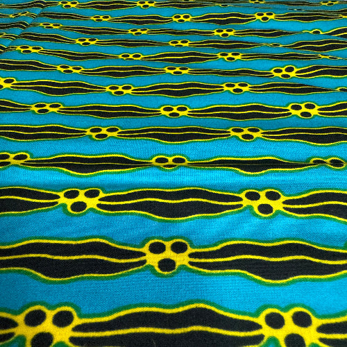 Patterned fabric with black and yellow design on a blue background