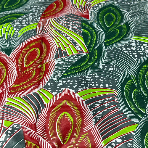 Close-up of a fabric with red, green, and gray abstract pattern