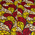 Stained glass window with red and yellow leaf patterns