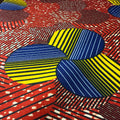 Colorful fabric pattern with blue, yellow, and red shapes