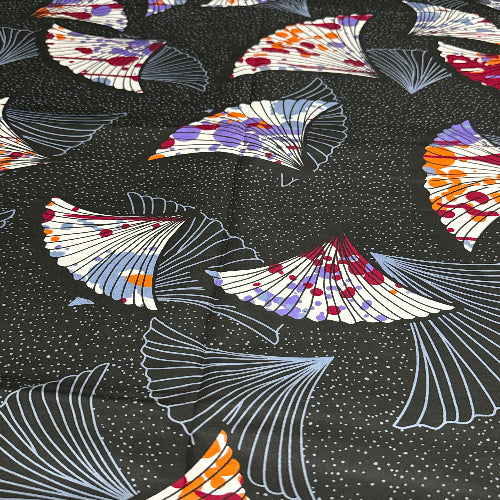 Pattern of colorful fans on a black background