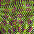 Patterned fabric with green and purple geometric design