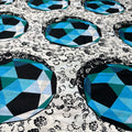 Geometric pattern with blue and black shapes on a textured background