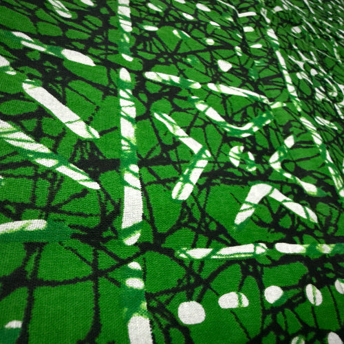 Green and white abstract patterned fabric