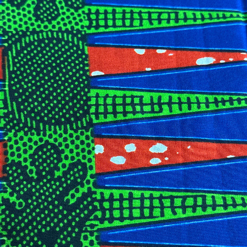 Colorful fabric pattern with blue, green, and red colors.