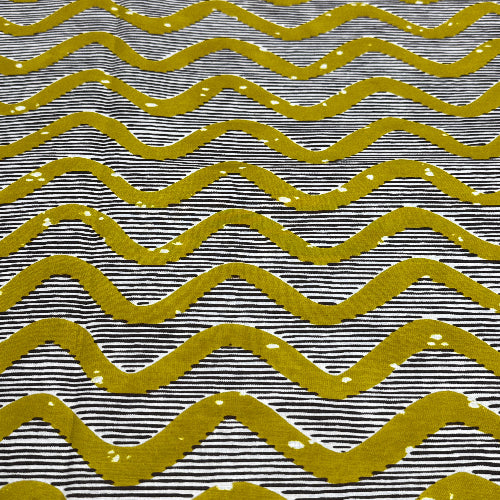 Pattern of wavy lines in yellow on a black and white background
