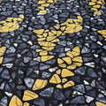 Patterned fabric with yellow and blue shapes on a black background