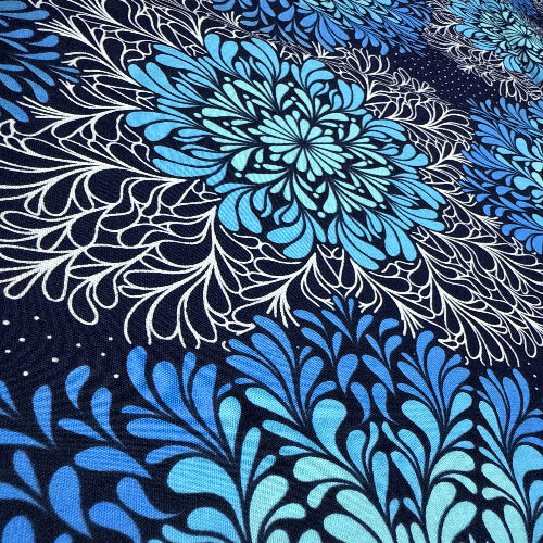 Blue and white floral pattern on a dark background