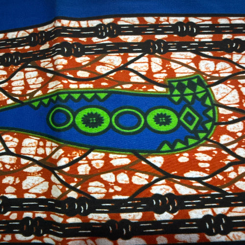 Decorative fabric with blue and green abstract design on a brown and white patterned background