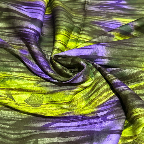 Fabric with green and purple abstract pattern